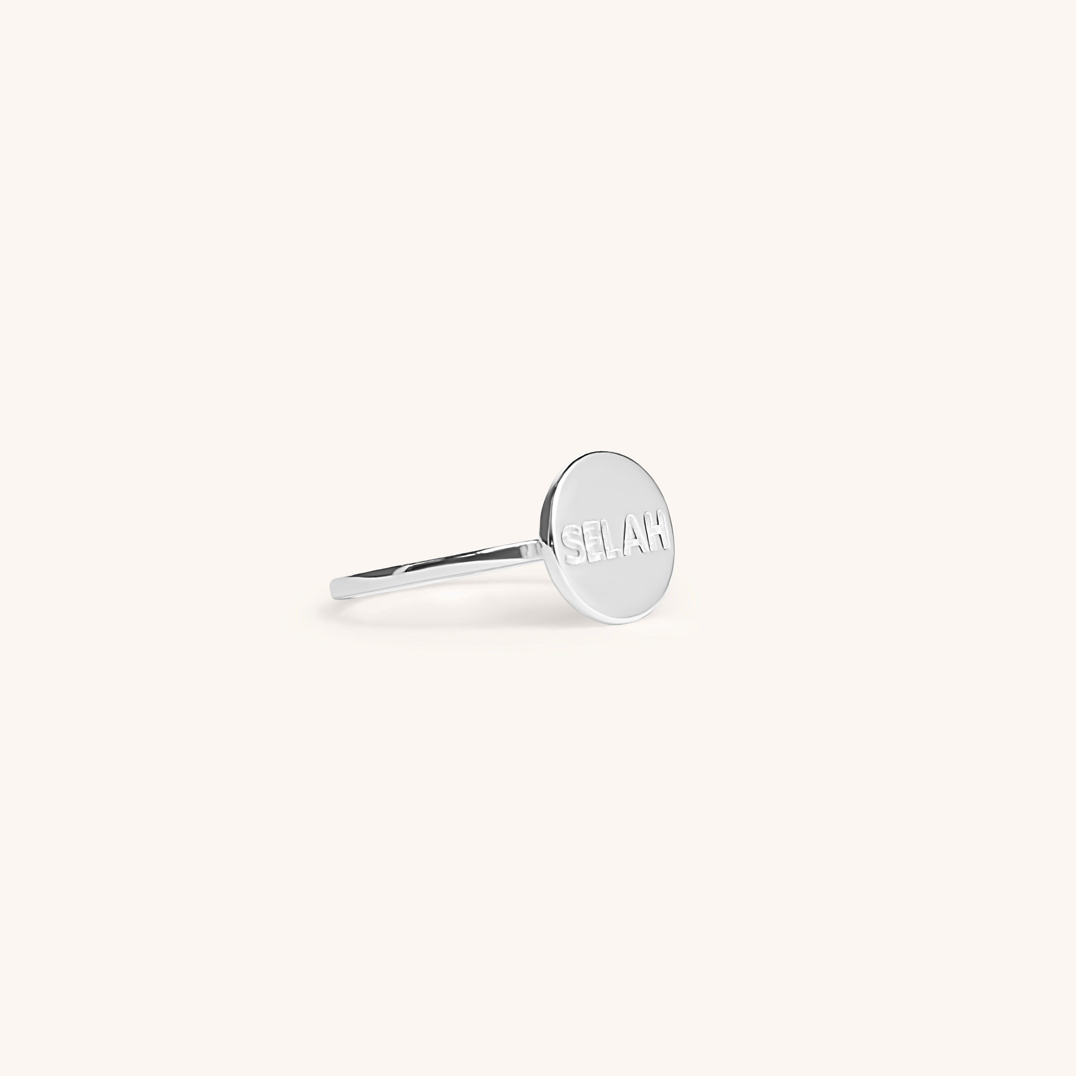 PS46 Jewelry Selah silver ring side view displayed on an off-white background.