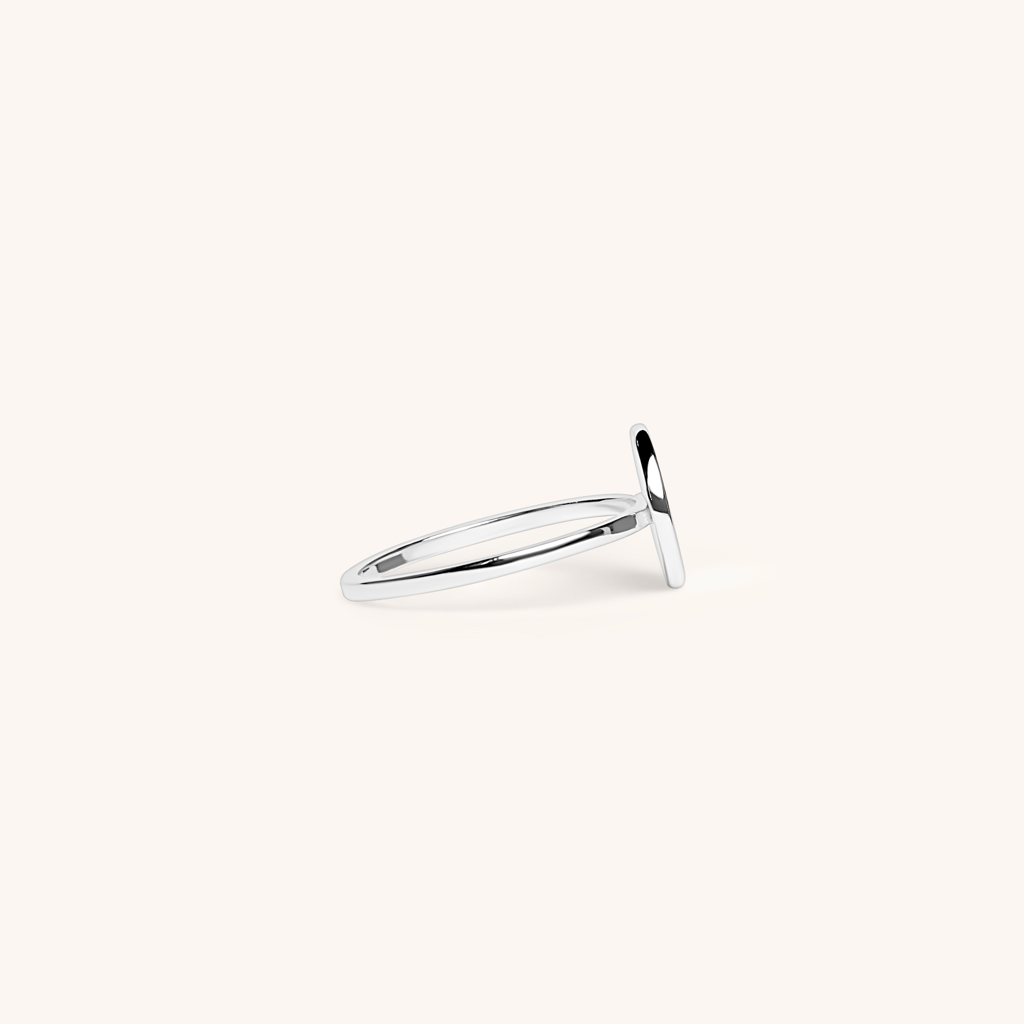 PS46 Jewelry Selah silver ring with thin band displayed on an off-white background.